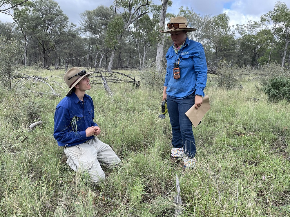 Brodie Crouch in the field with a female researcher.