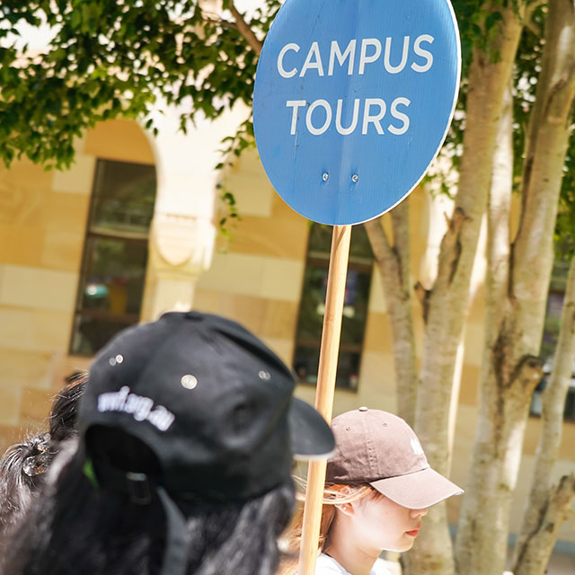 students in front of the UQ Gatton sign