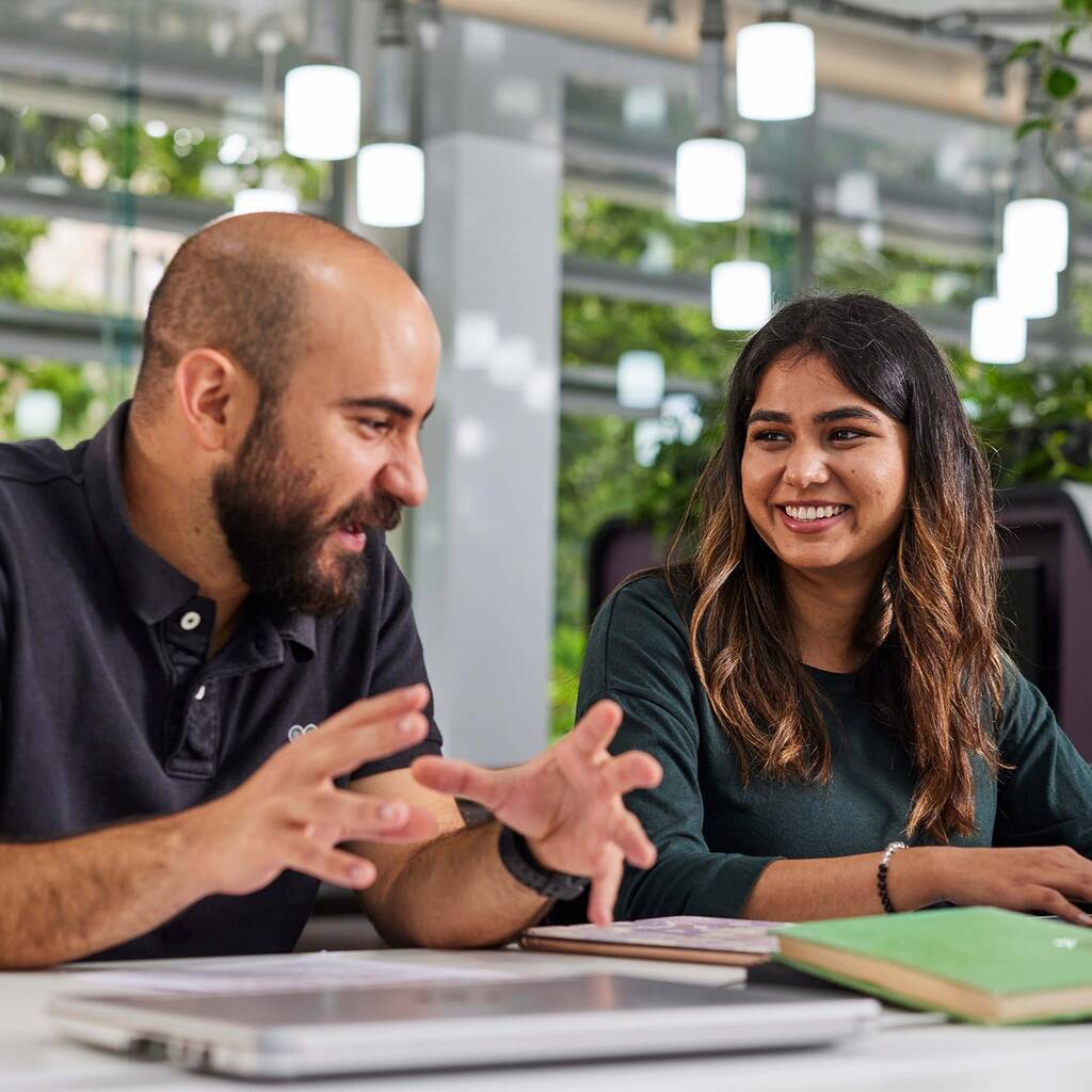 man and woman talking in the Science Learning Centre