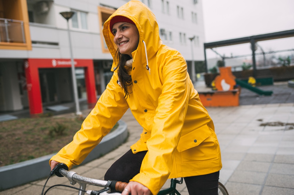 Woman cycling in rain
