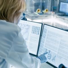 Scientists looking at a computer screen