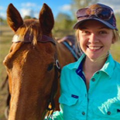Scholarship recipient with a horse