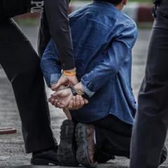 man handcuffed by police